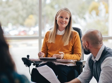 A leader presenting to a group of people.