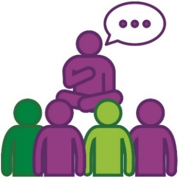 A group of people listening to an Elder speak.