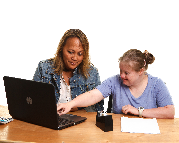 2 people using a laptop together.
