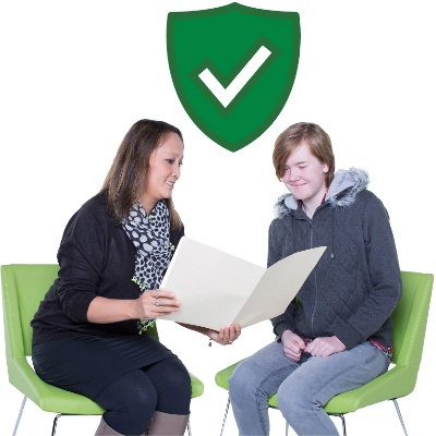 2 people sitting together looking at a folder. Above is a safety icon. A safety icon is a shield with a tick.