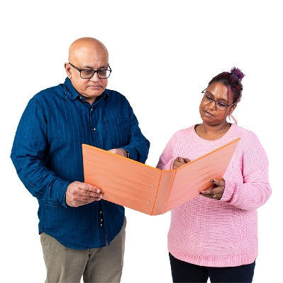 A person supporting someone to read a document.