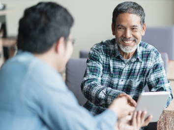 A participant and a worker having a conversation.