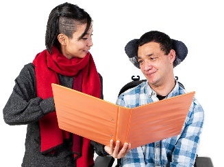 A participant and a worker looking at a document together.