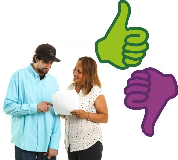 A participant and a support worker looking at a document together. Next to them are a thumbs up and a thumbs down.