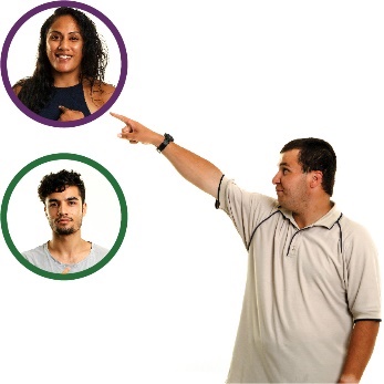 A participant making a choice between 2 support workers. They are pointing at one of the support workers.