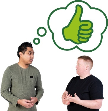 A participant and a worker having a conversation. Above the worker is a thumbs up in a thought bubble.