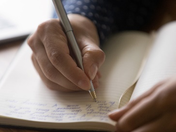 A participant writing on a document.