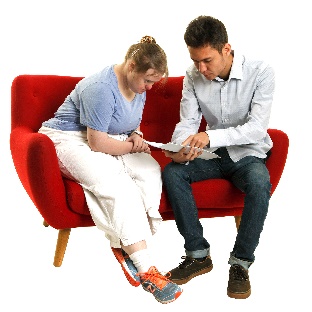 A participant and someone else looking at a document together.