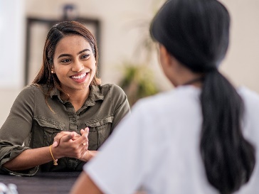 A participant and a worker having a conversation.