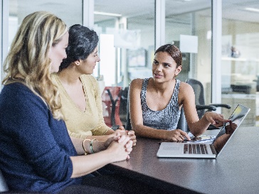 A group of people working together in an office.