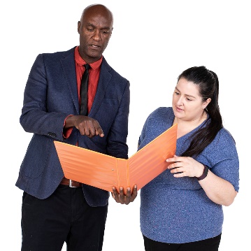 A worker supporting a participant to read a document.