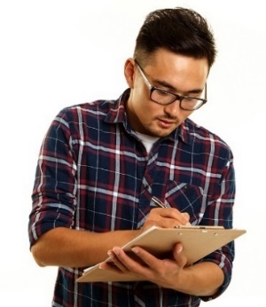 A person writing on a document.