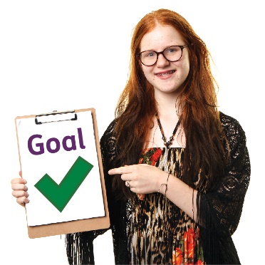 A person holding a document called 'Goal' with a tick on it.