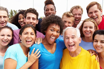 A large group of people smiling.