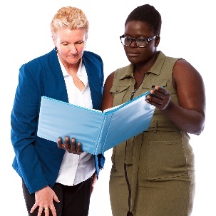 2 people looking at a document.