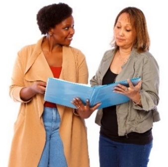 2 people looking at a document.