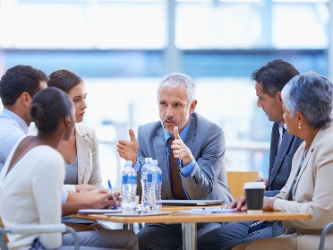 A group of people having a meeting. 