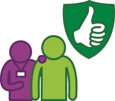 A provider supporting a participant. Next to them is a safety icon.