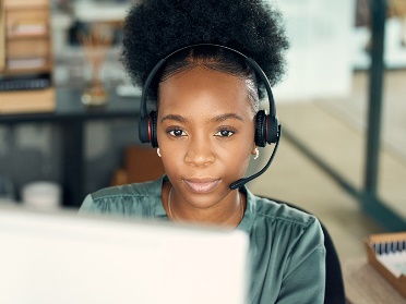 A person with a call headset. 