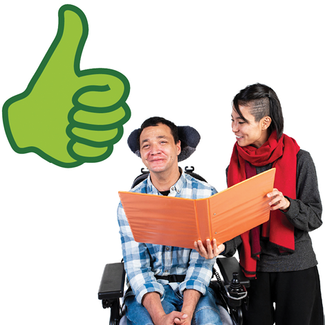 A person supporting someone to read a document. Above them is a thumbs up.