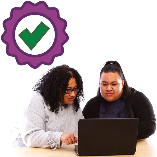 2 people using a laptop. Above them is a badge with a tick.
