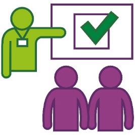 A person presenting at a training session. They are pointing to a ticked checkbox.