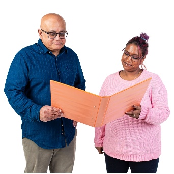 2 people looking at a document together.